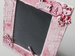 A mixed media photo frame